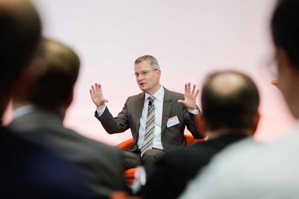 A speaker gestures during a panel discussion at the Handelsblatt event 'European Banking Regulation'. Experienced and Reliable Event Photographer Martin Leissl in Frankfurt