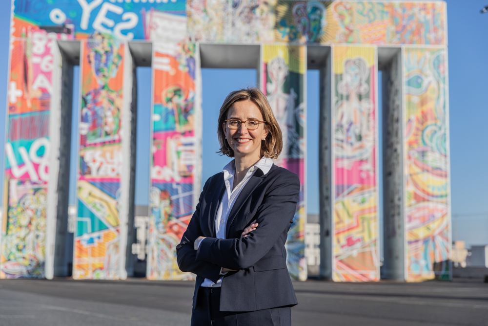 Portrait of the CEO of Lufthansa Cargo, Dorothea von Boxberg, in front of the Brandenburg Gate, which has been replicated with freight containers.