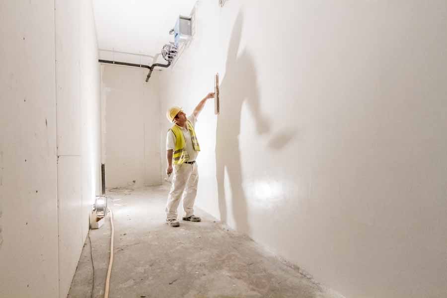 A painter paints a wall in the new Clariant Innovation Center, Industriepark Höchst, Frankfurt.
