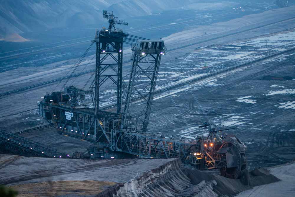 A giant excavator operates at the Garzweiler open cast lignite mine, operated by RWE AG, in Garzweiler, Germany